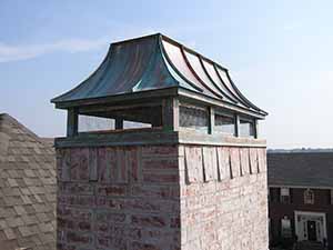 Full coverage hip and ridge chimney cap